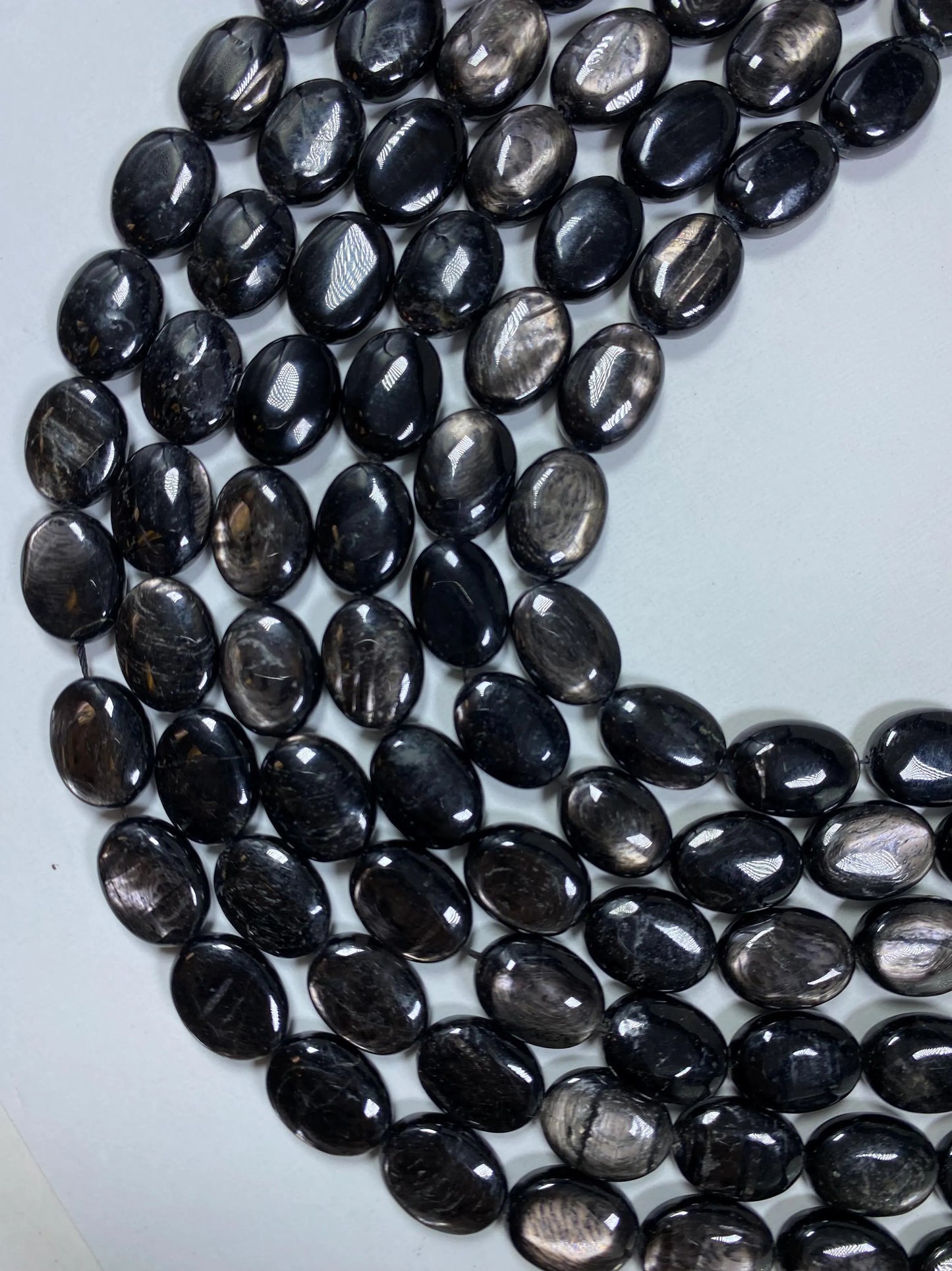 Natural Hypersthene Gemstone Beads: Black Oval Shape Rainbow Flash, 15.5" Strand