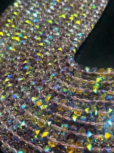 Light pink rainbow crystal glass beads. Chinese crystal rondelle shape 5x8mm. Great quality glass, full strand.