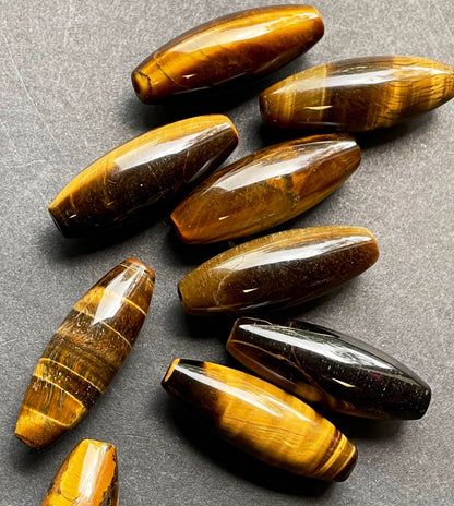 Beautiful natural tiger eye stone bead. 14x40mm barrel shape bead. Gorgeous natural golden yellow color tiger eye gemstone bead.