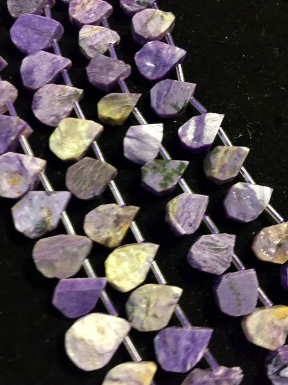 Natural Charoite beads teardrop shape 11x15mm natural Charoite gemstone color . Guaranteed 100% natural Charlotte bead . Full strand 15.5”