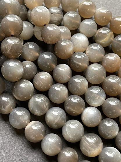 AAA Natural gray moonstone bead. 5mm, 6mm, 7mm, 8mm, 9mm, 10mm round stone bead. Beautiful natural rainbow flash on. Full strand 15.5”
