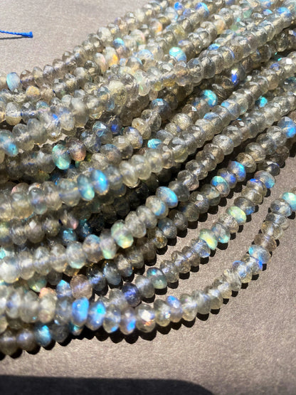 AA Natural blue flash labradorite stone bead . Faceted 3x4mm Rondelle Shape bead. Gorgeous gray color with beautiful blue flash full strand