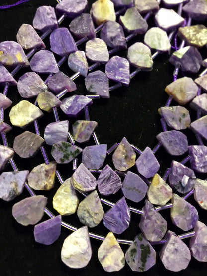 Natural Charoite beads teardrop shape 11x15mm natural Charoite gemstone color . Guaranteed 100% natural Charlotte bead . Full strand 15.5”