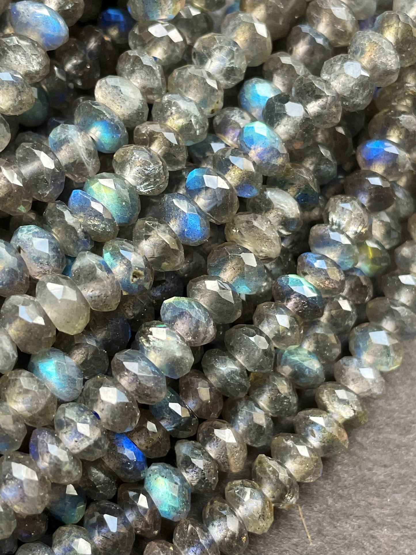 AA Natural blue flash labradorite stone bead . Faceted 3x4mm Rondelle Shape bead. Gorgeous gray color with beautiful blue flash full strand