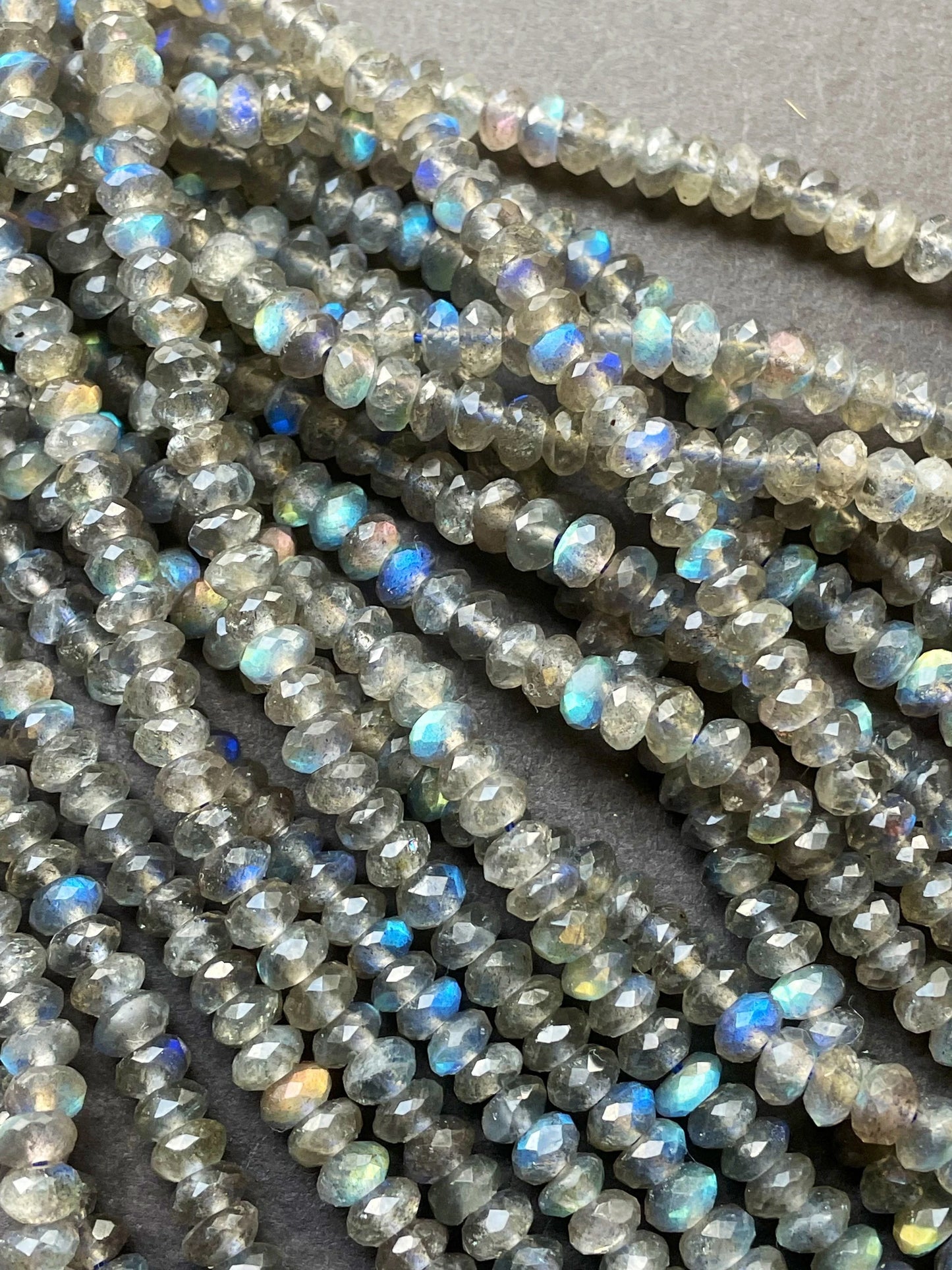 AA Natural blue flash labradorite stone bead . Faceted 3x4mm Rondelle Shape bead. Gorgeous gray color with beautiful blue flash full strand