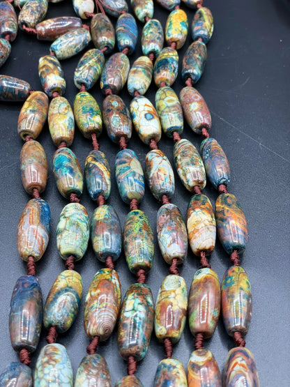 Beautiful natural Tibetan gemstone bead. 12x40mm barrel shape. Beautiful brown blue orange color gemstone. Full strand 15.5”