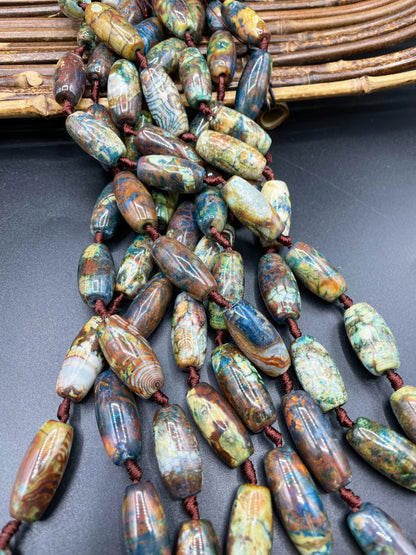Beautiful natural Tibetan gemstone bead. 12x40mm barrel shape. Beautiful brown blue orange color gemstone. Full strand 15.5”