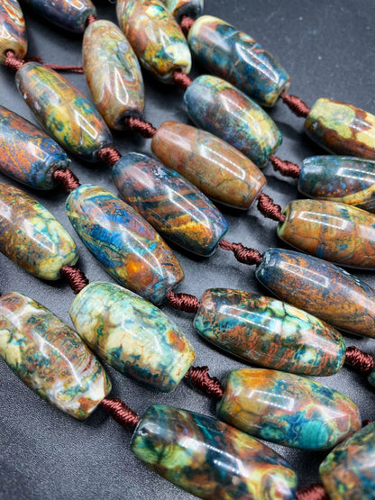 Beautiful natural Tibetan gemstone bead. 12x40mm barrel shape. Beautiful brown blue orange color gemstone. Full strand 15.5”