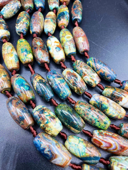 Beautiful natural Tibetan gemstone bead. 12x40mm barrel shape. Beautiful brown blue orange color gemstone. Full strand 15.5”