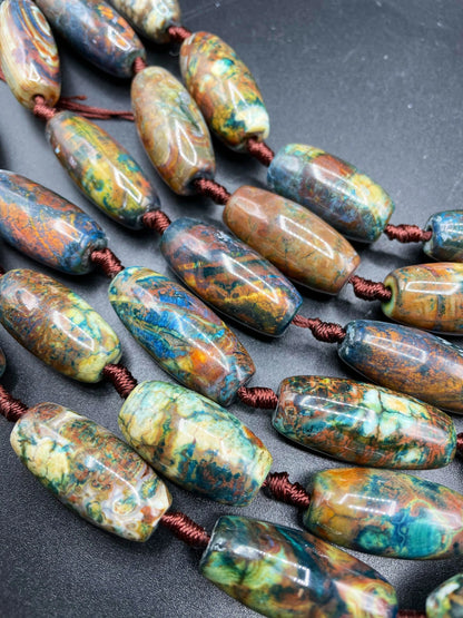 Beautiful natural Tibetan gemstone bead. 12x40mm barrel shape. Beautiful brown blue orange color gemstone. Full strand 15.5”