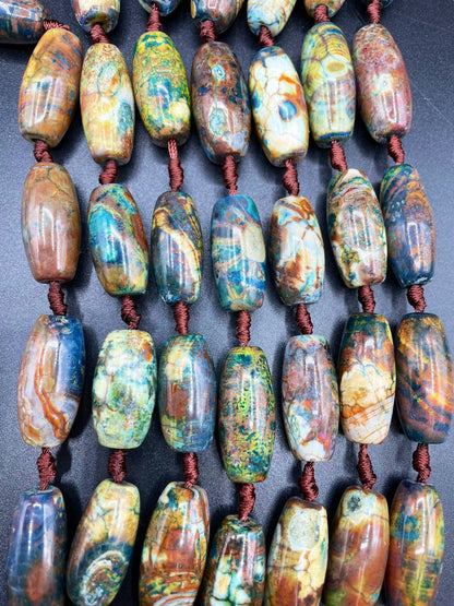 Beautiful natural Tibetan gemstone bead. 12x40mm barrel shape. Beautiful brown blue orange color gemstone. Full strand 15.5”