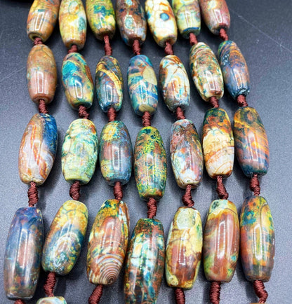 Beautiful natural Tibetan gemstone bead. 12x40mm barrel shape. Beautiful brown blue orange color gemstone. Full strand 15.5”