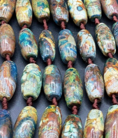 Beautiful natural Tibetan gemstone bead. 12x40mm barrel shape. Beautiful brown blue orange color gemstone. Full strand 15.5”