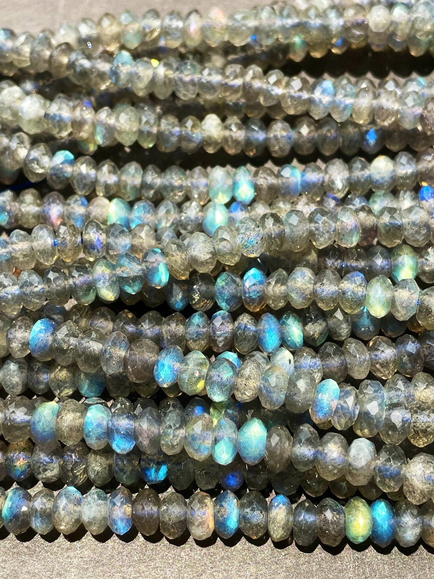 AA Natural blue flash labradorite stone bead . Faceted 3x4mm Rondelle Shape bead. Gorgeous gray color with beautiful blue flash full strand