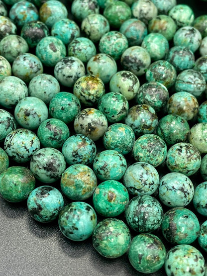 AAA Natural African turquoise stone bead. 6mm 8mm 10mm round bead . Gorgeous natural turquoise green blue with black points Gemstone,