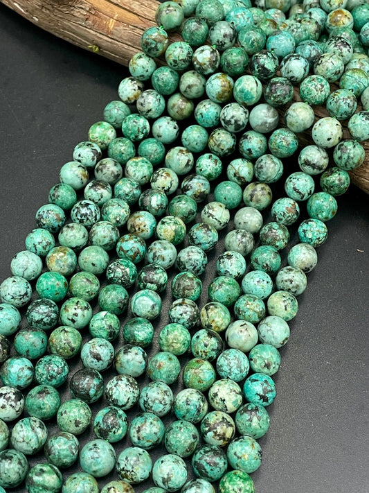 AAA Natural African turquoise stone bead. 6mm 8mm 10mm round bead . Gorgeous natural turquoise green blue with black points Gemstone,