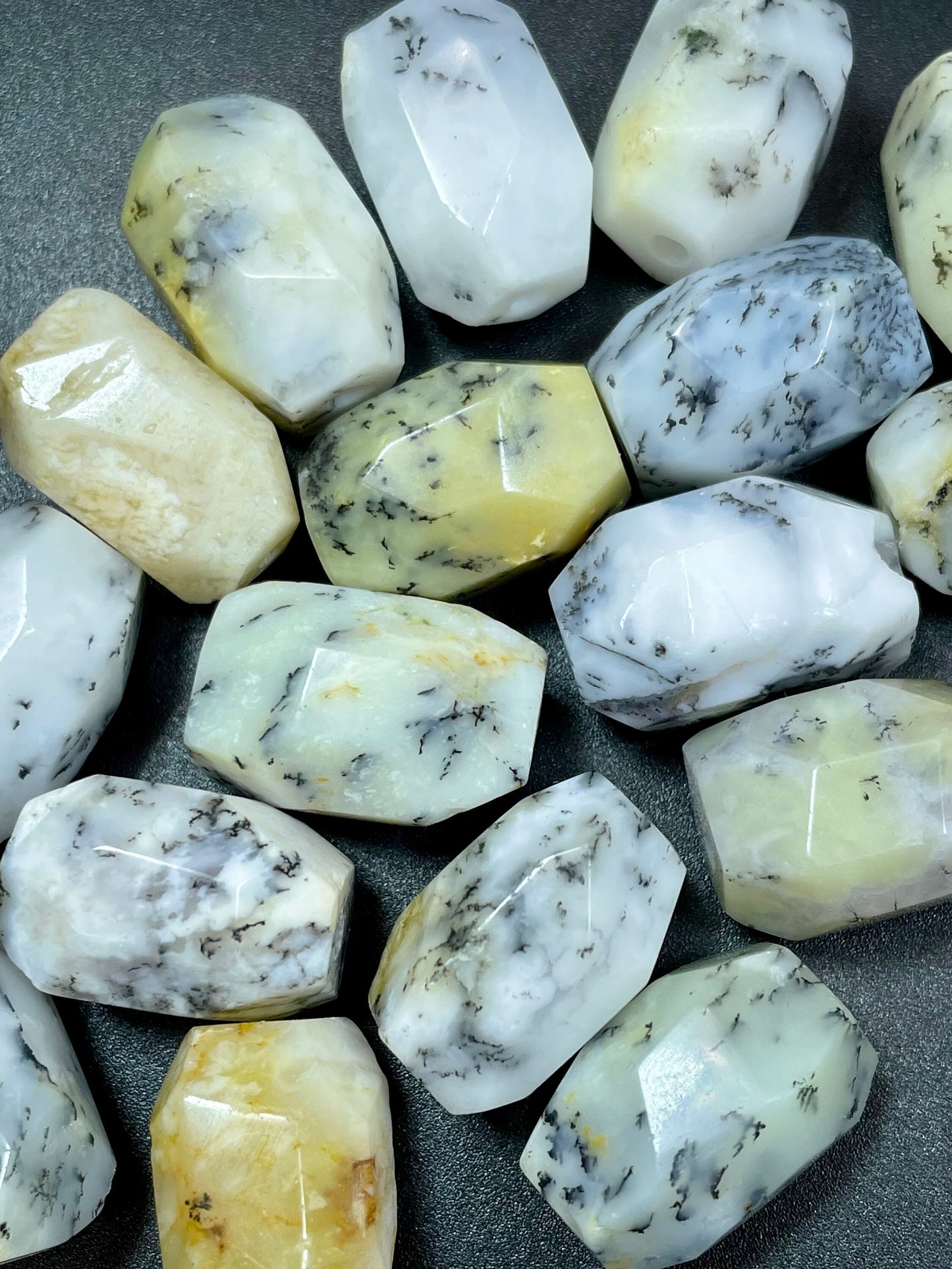 AAA Natural white opal gemstone bead. Faceted 13x19mm barrel shape bead. Beautiful natural white color with gray points. High quality bead!