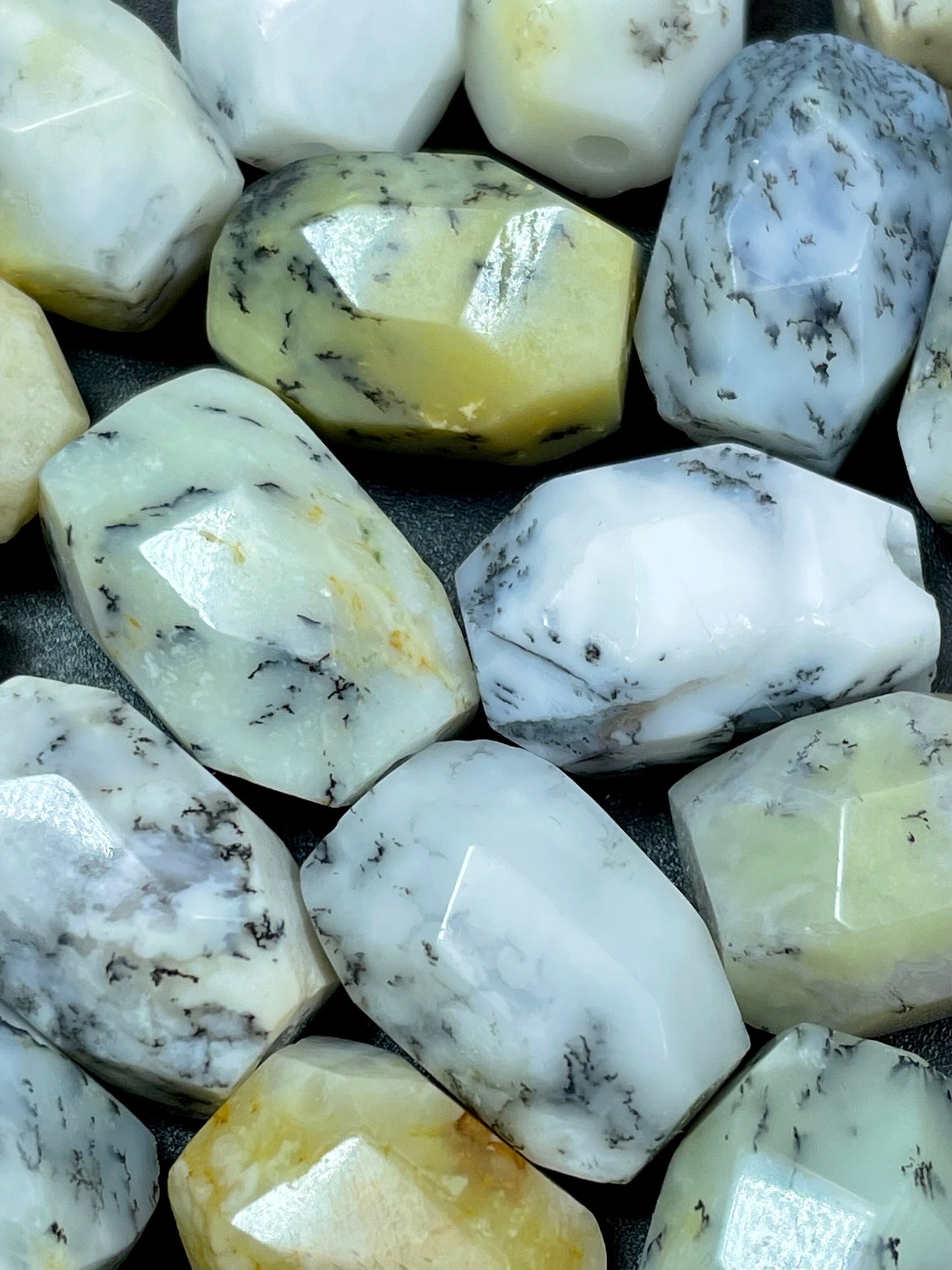 AAA Natural white opal gemstone bead. Faceted 13x19mm barrel shape bead. Beautiful natural white color with gray points. High quality bead!