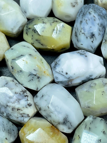 AAA Natural white opal gemstone bead. Faceted 13x19mm barrel shape bead. Beautiful natural white color with gray points. High quality bead!