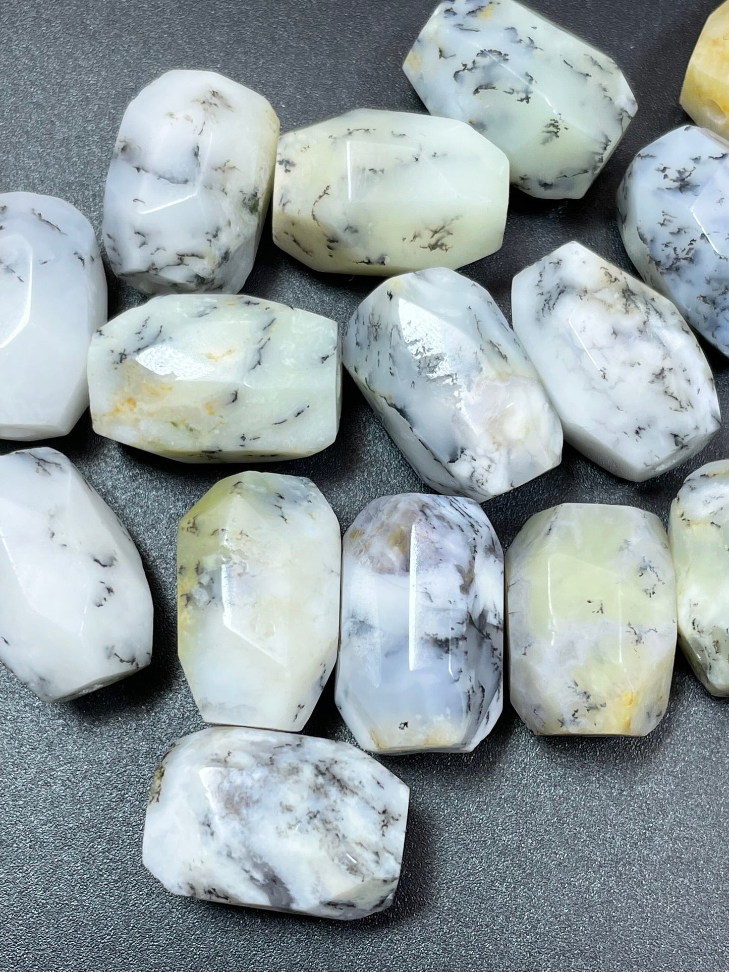 AAA Natural white opal gemstone bead. Faceted 13x19mm barrel shape bead. Beautiful natural white color with gray points. High quality bead!