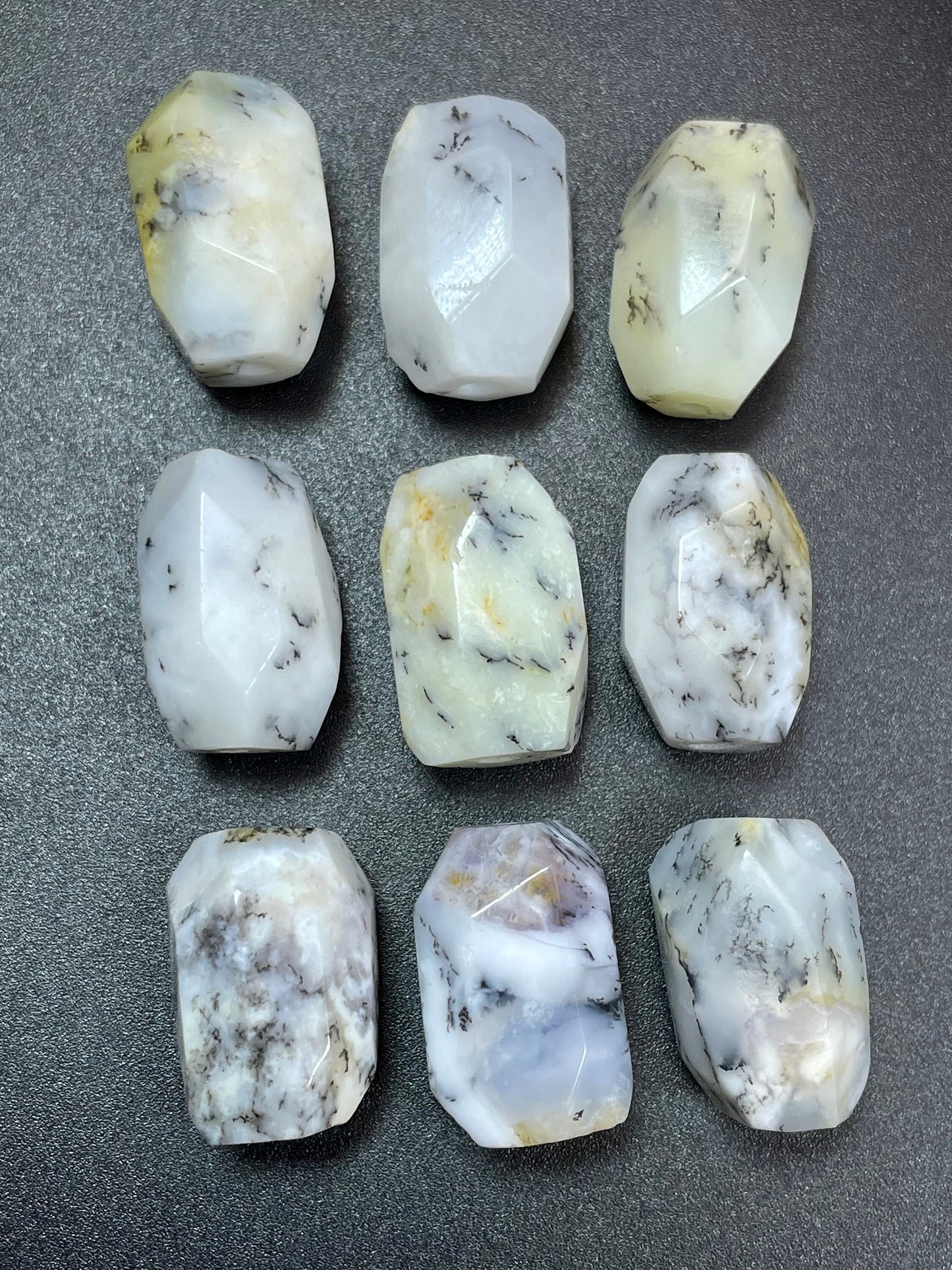 AAA Natural white opal gemstone bead. Faceted 13x19mm barrel shape bead. Beautiful natural white color with gray points. High quality bead!