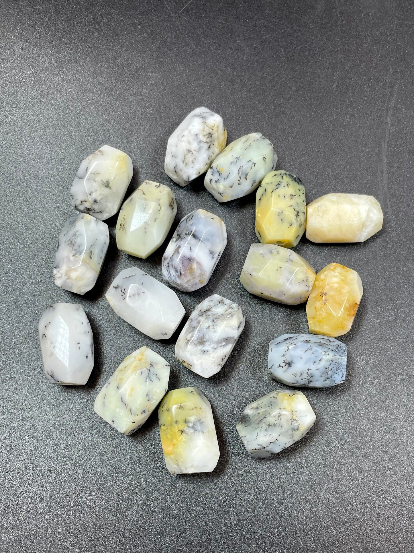 AAA Natural white opal gemstone bead. Faceted 13x19mm barrel shape bead. Beautiful natural white color with gray points. High quality bead!