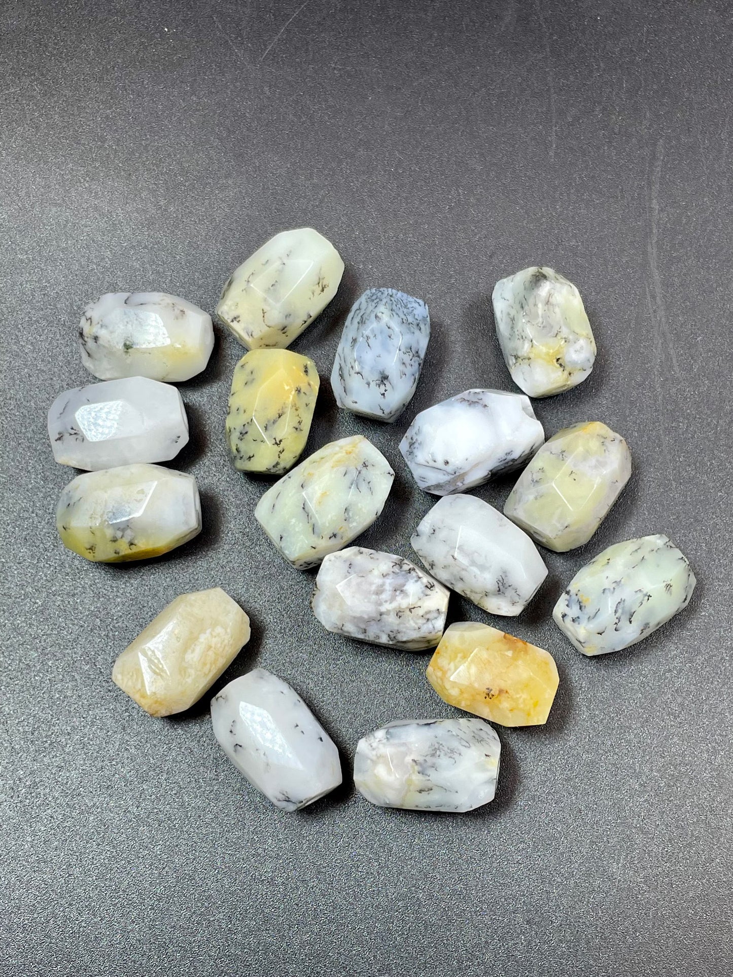 AAA Natural white opal gemstone bead. Faceted 13x19mm barrel shape bead. Beautiful natural white color with gray points. High quality bead!