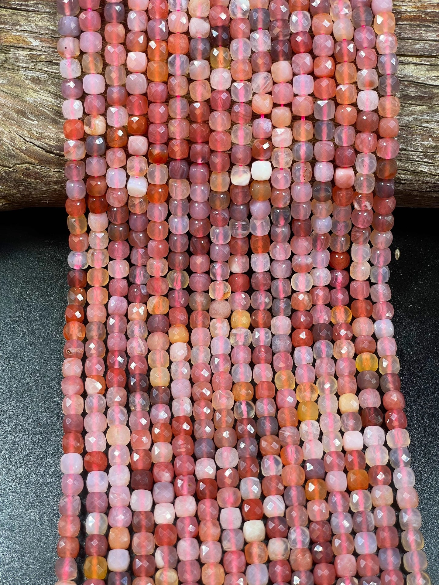 Natural red Botswana gemstone bead. Faceted 5mm cube shape bead. Gorgeous natural orange brown crammy white color. Full strand 15.5”