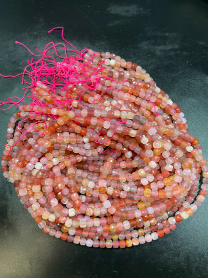 Natural red Botswana gemstone bead. Faceted 5mm cube shape bead. Gorgeous natural orange brown crammy white color. Full strand 15.5”