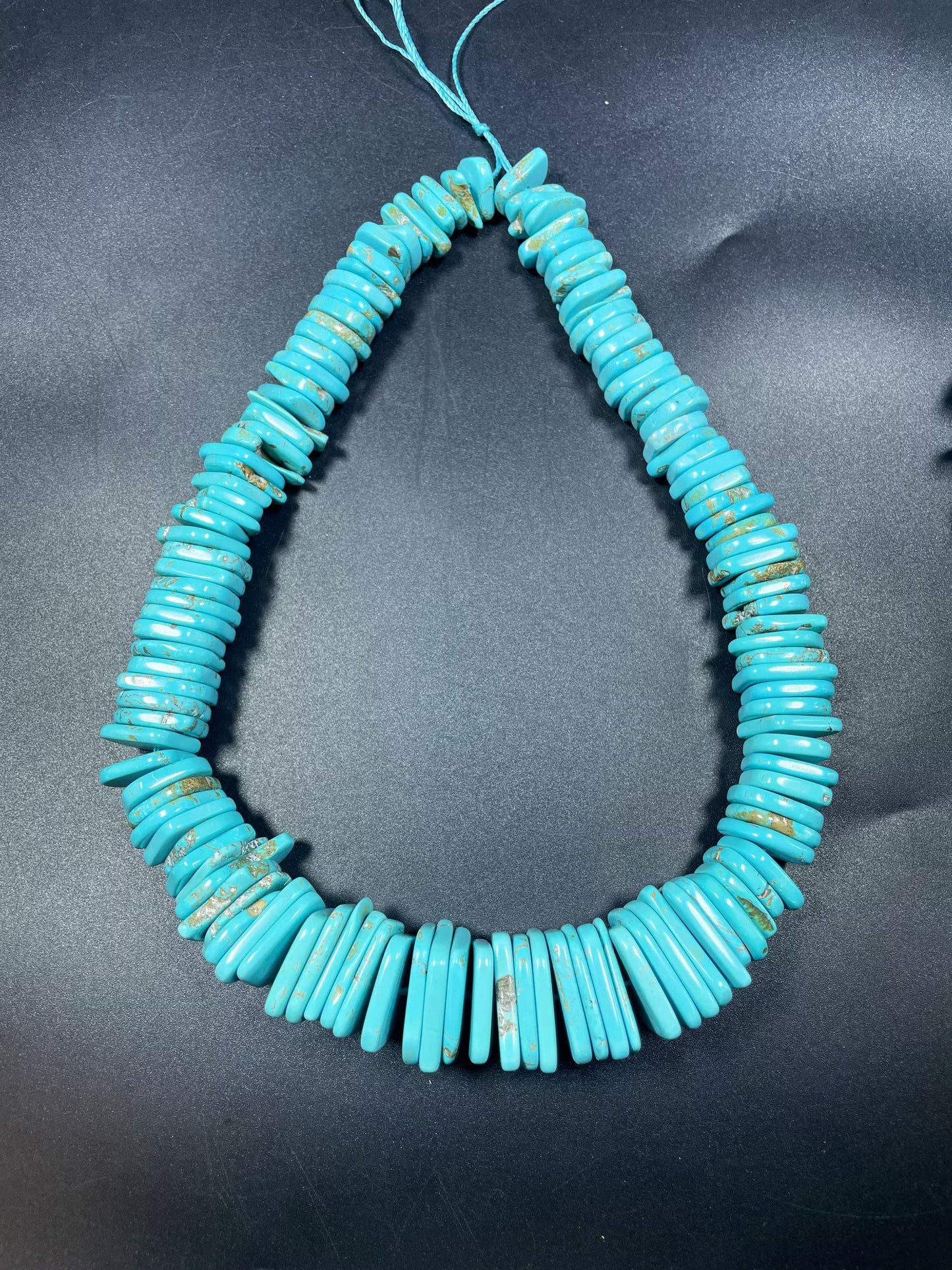 Natural blue turquoise gemstone bead . Graduated shape. Beautiful turquoise blue color. Nice polished turquoise howlite gemstone bead!