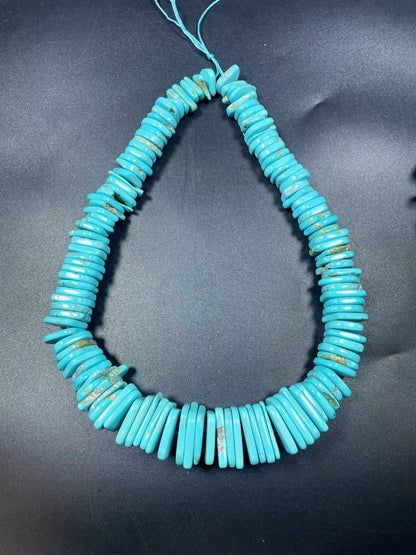 Natural blue turquoise gemstone bead . Graduated shape. Beautiful turquoise blue color. Nice polished turquoise howlite gemstone bead!