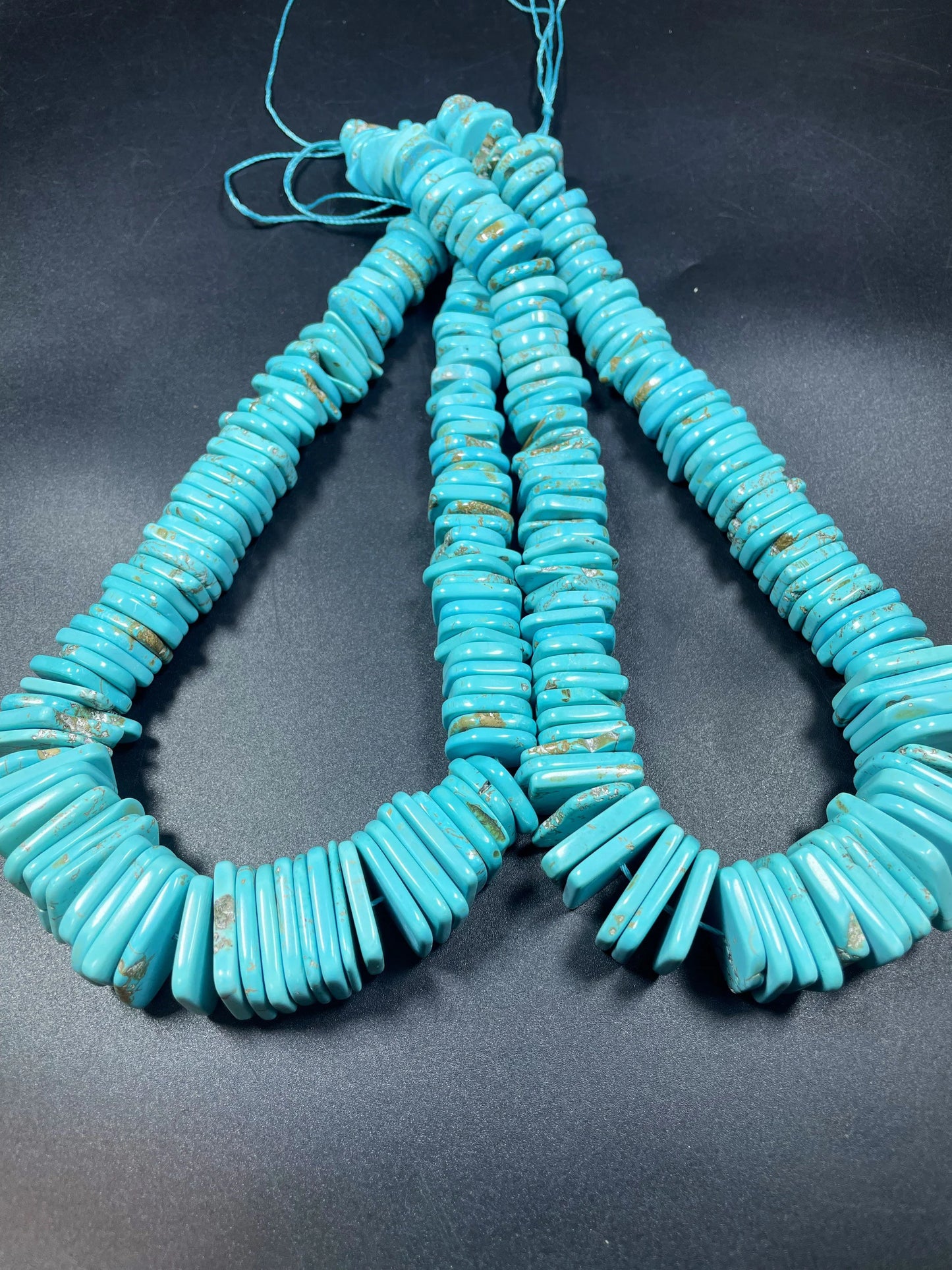 Natural blue turquoise gemstone bead . Graduated shape. Beautiful turquoise blue color. Nice polished turquoise howlite gemstone bead!