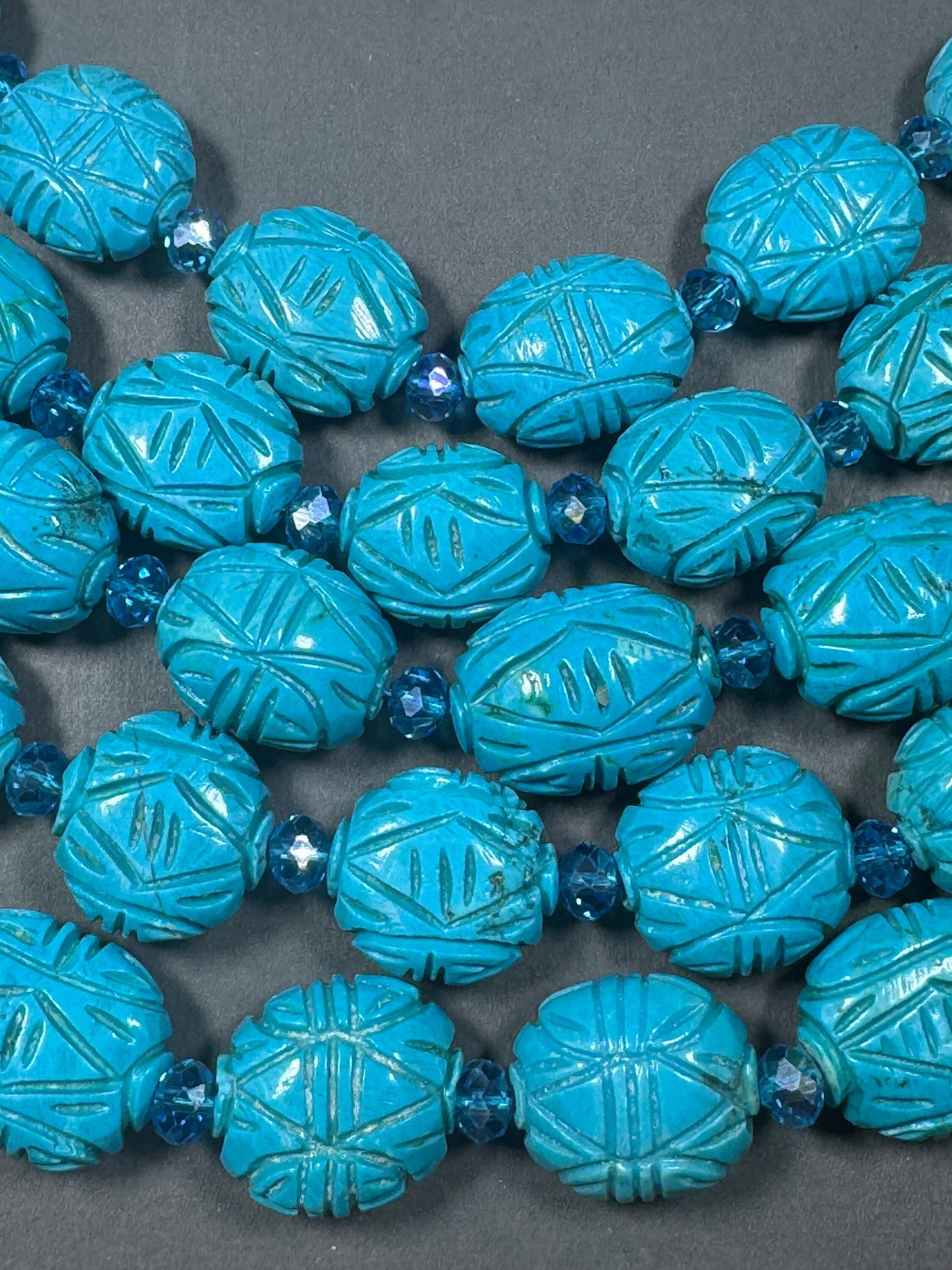 hand carved turquoise gemstone bead . 35mm oval shape . excellent quality blue turquoise beads . full strand 15.5”