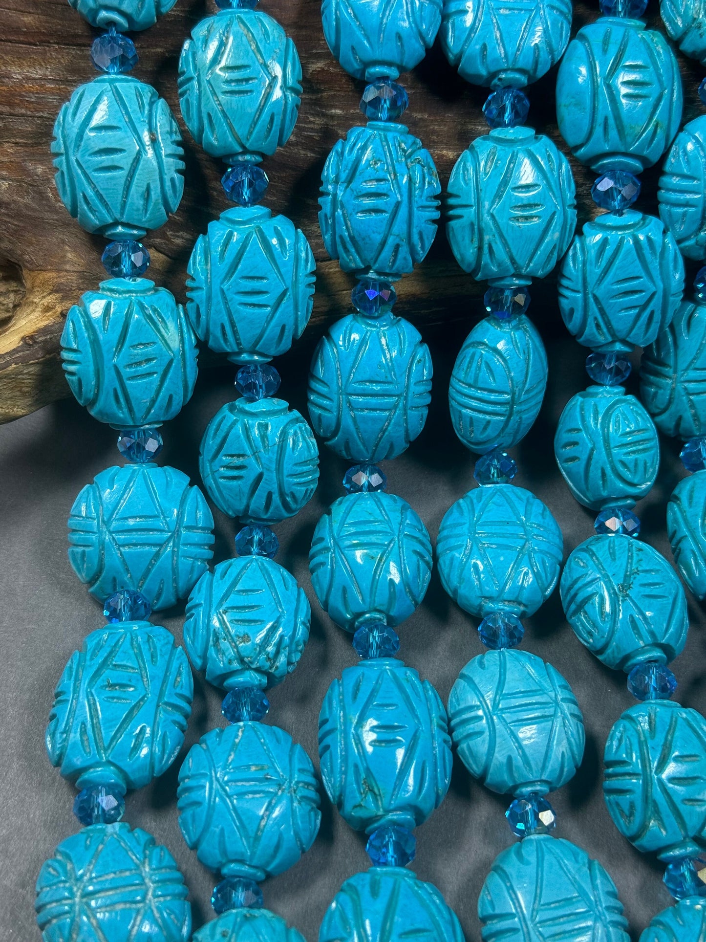 hand carved turquoise gemstone bead . 35mm oval shape . excellent quality blue turquoise beads . full strand 15.5”