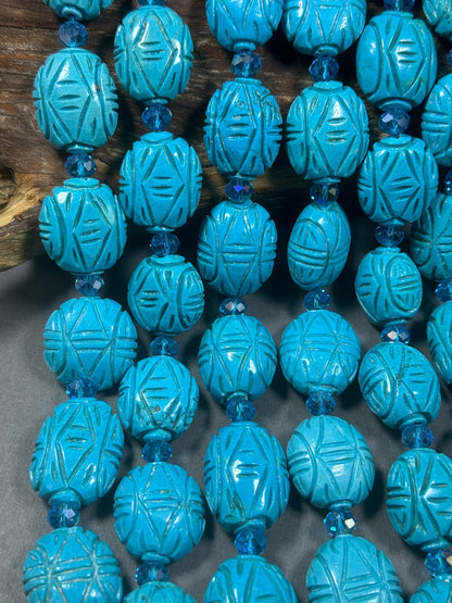 hand carved turquoise gemstone bead . 35mm oval shape . excellent quality blue turquoise beads . full strand 15.5”