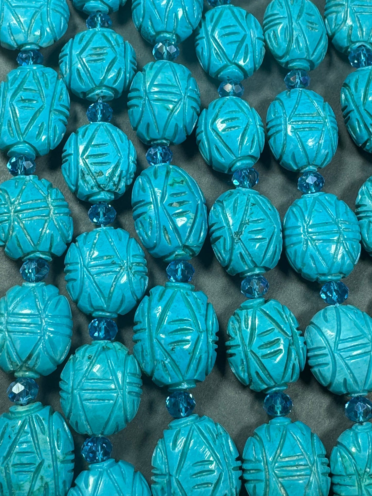 hand carved turquoise gemstone bead . 35mm oval shape . excellent quality blue turquoise beads . full strand 15.5”