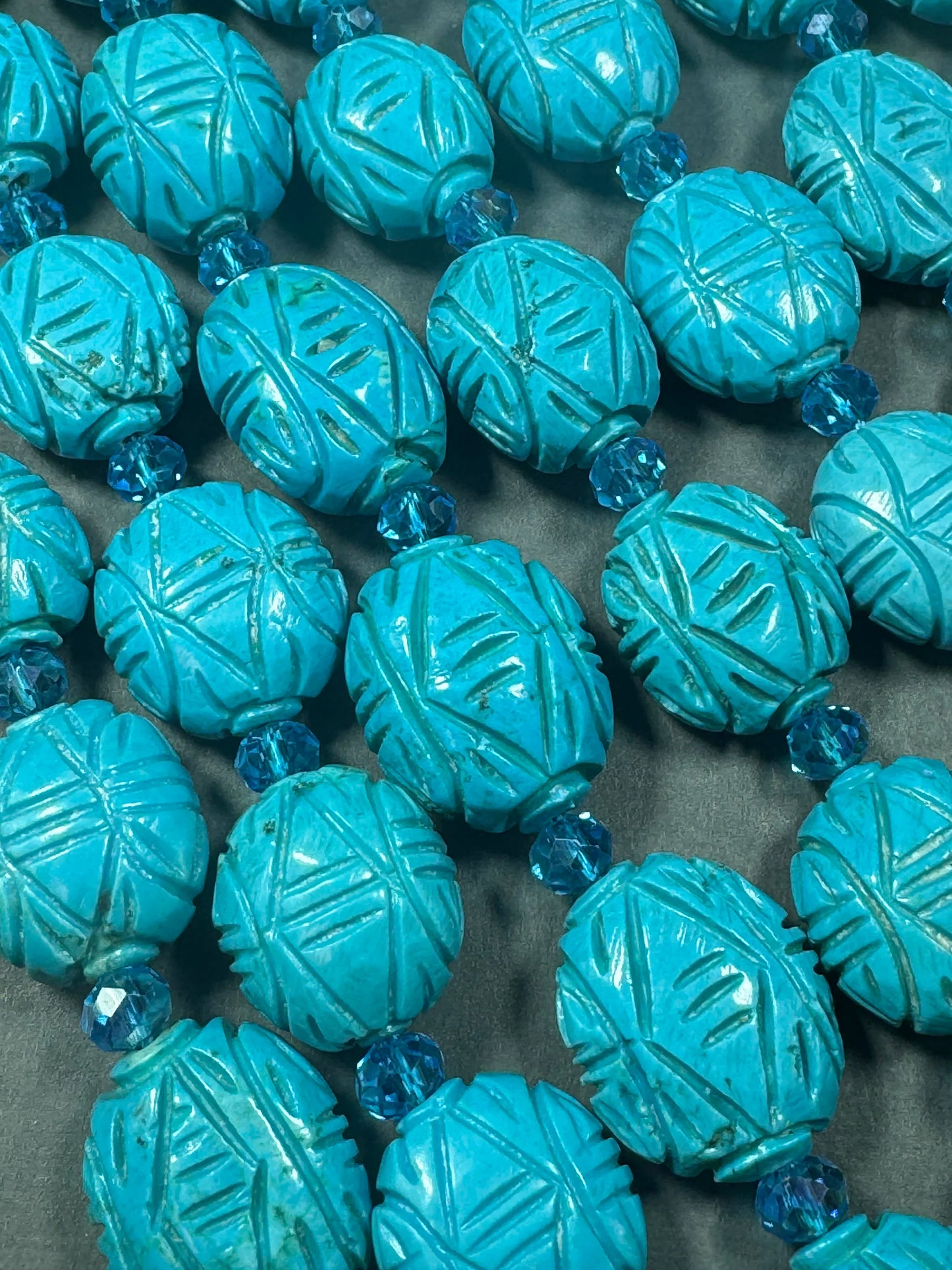 hand carved turquoise gemstone bead . 35mm oval shape . excellent quality blue turquoise beads . full strand 15.5”