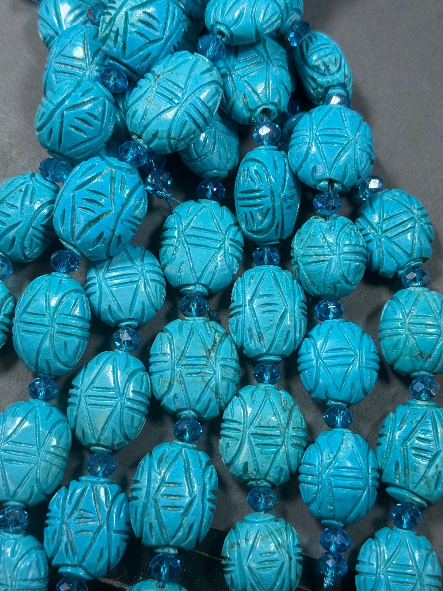 hand carved turquoise gemstone bead . 35mm oval shape . excellent quality blue turquoise beads . full strand 15.5”