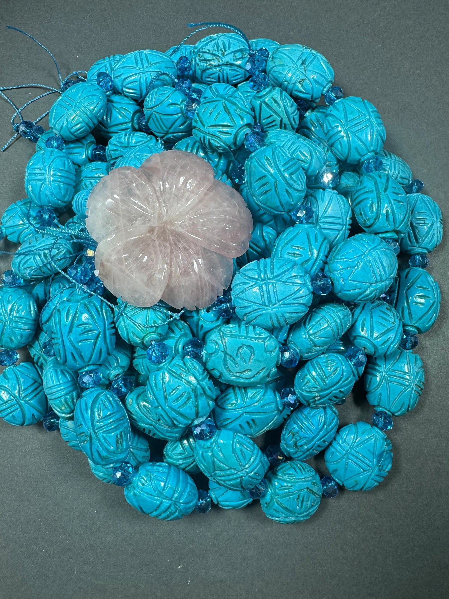 hand carved turquoise gemstone bead . 35mm oval shape . excellent quality blue turquoise beads . full strand 15.5”