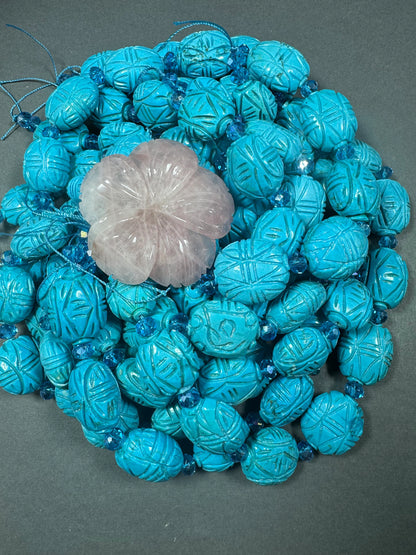 hand carved turquoise gemstone bead . 35mm oval shape . excellent quality blue turquoise beads . full strand 15.5”
