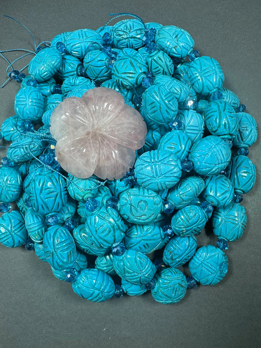 hand carved turquoise gemstone bead . 35mm oval shape . excellent quality blue turquoise beads . full strand 15.5”