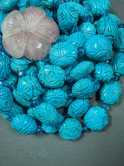 hand carved turquoise gemstone bead . 35mm oval shape . excellent quality blue turquoise beads . full strand 15.5”