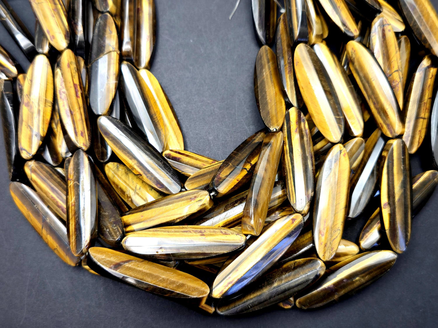 AAA Natural tiger eye faceted oval strips stone bead . .Gorgeous golden brown color tiger eye . Great quality gemstone . 15.5” 14x50mm