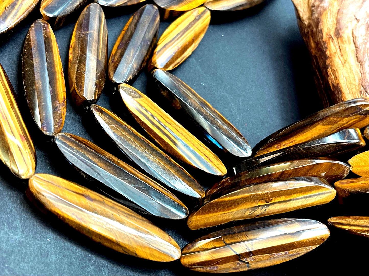AAA Natural tiger eye faceted oval strips stone bead . .Gorgeous golden brown color tiger eye . Great quality gemstone . 15.5” 14x50mm