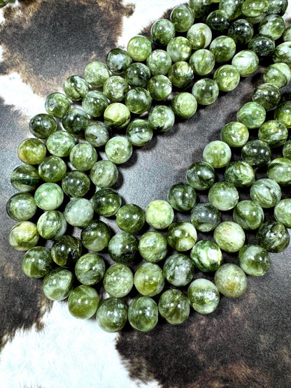Natural green lepidolite gemstone beads . beautiful green color . not treated . excellent quality. full strand 15.5”