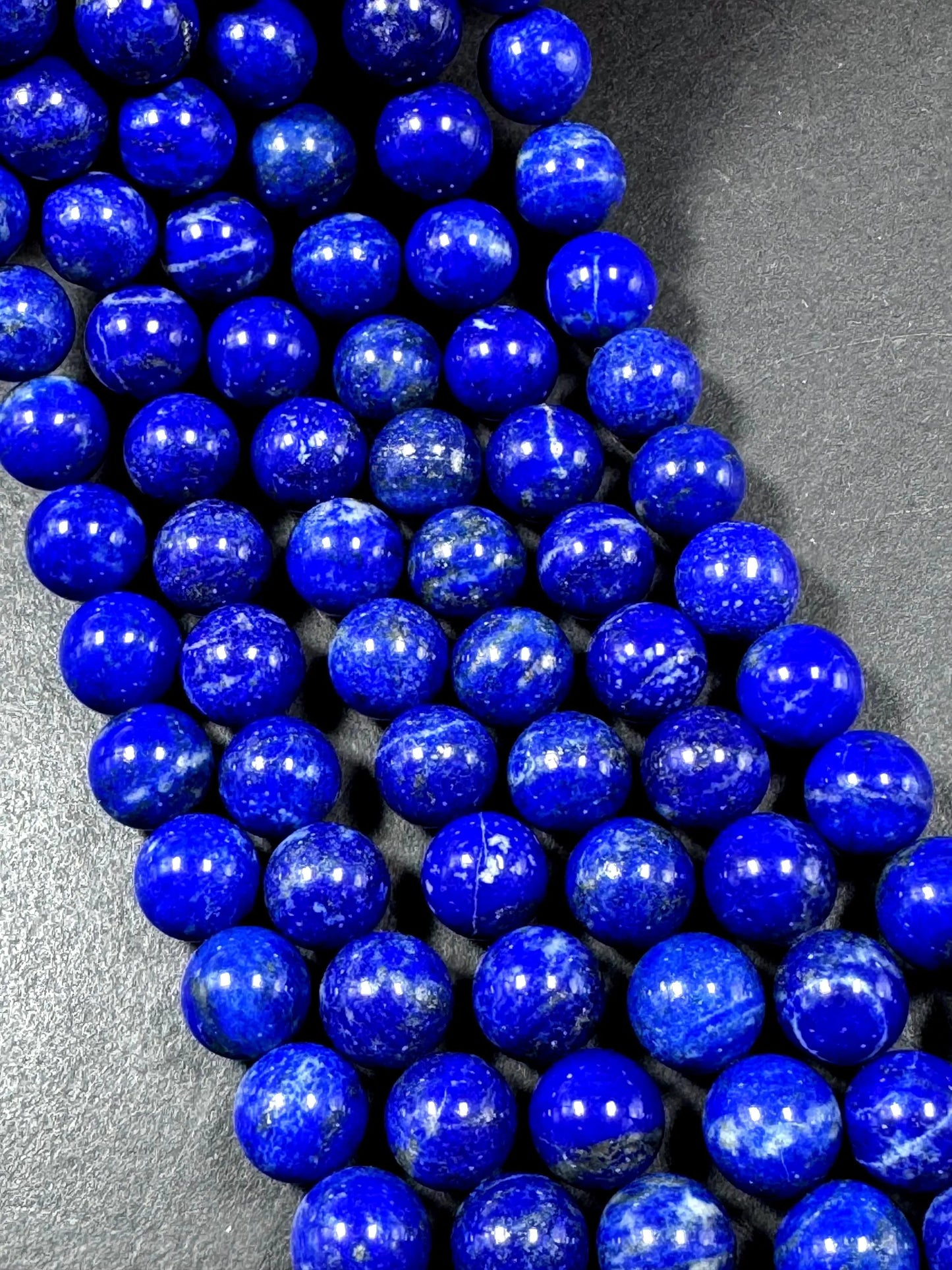 100% Natural lapis lazuli gemstone bead. smooth round beads. gorgeous natural royal blue color. not treated . excellent quality .full strand
