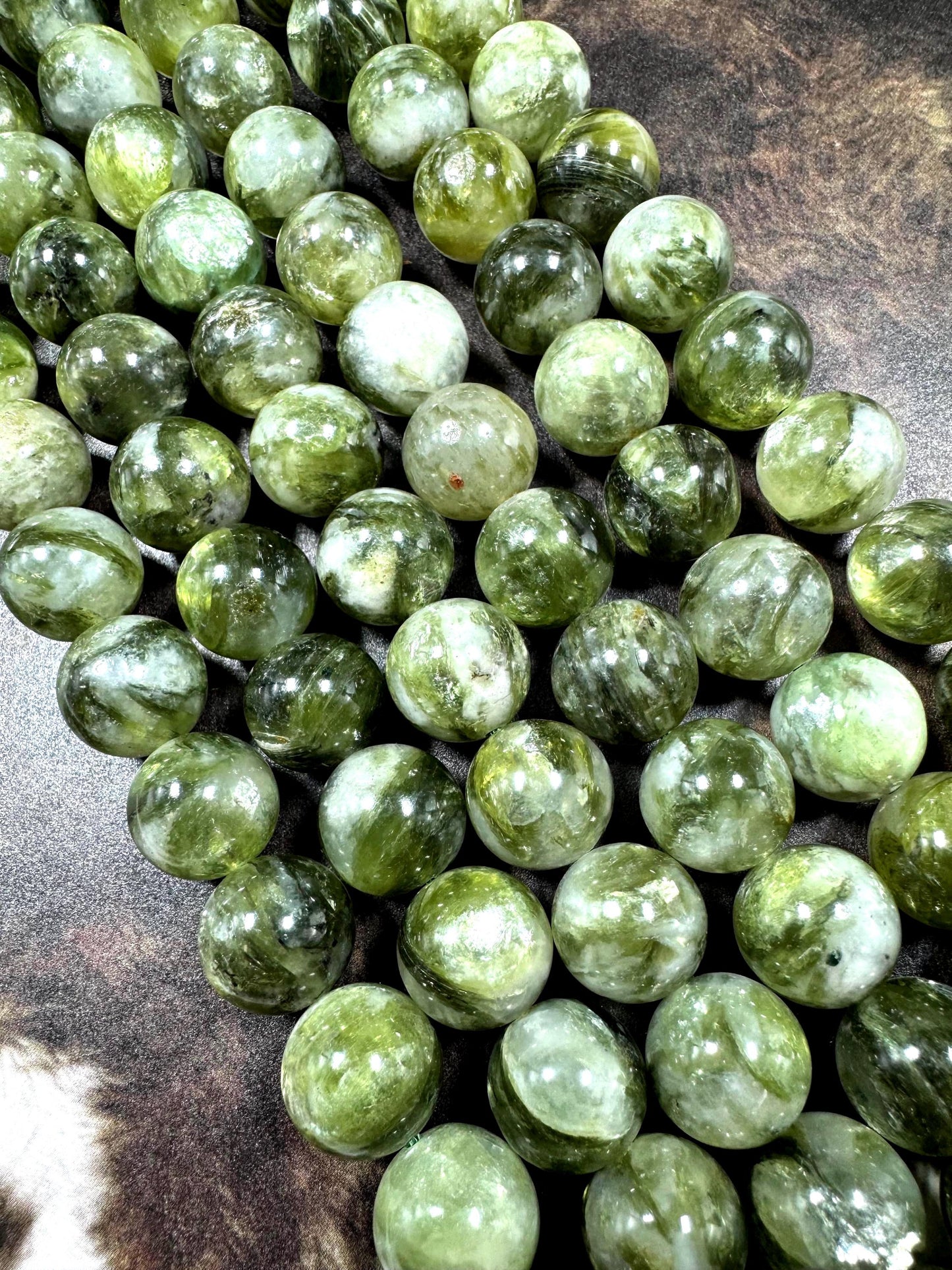 Natural green lepidolite gemstone beads . beautiful green color . not treated . excellent quality. full strand 15.5”