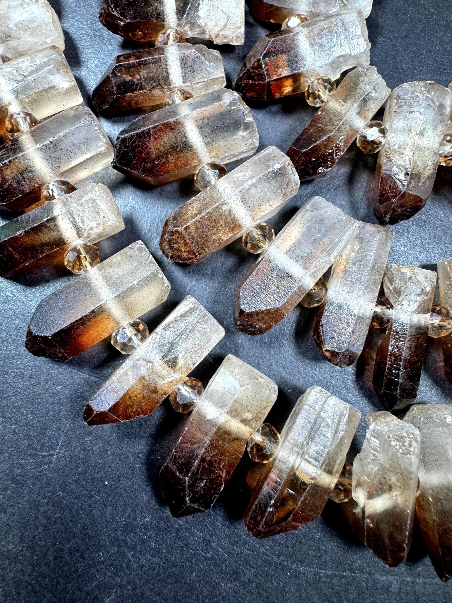 100% Natural Rock Crystal Quartz. Freedom Teeth Shape. Clear Brown Color. Full Strand 15.5"