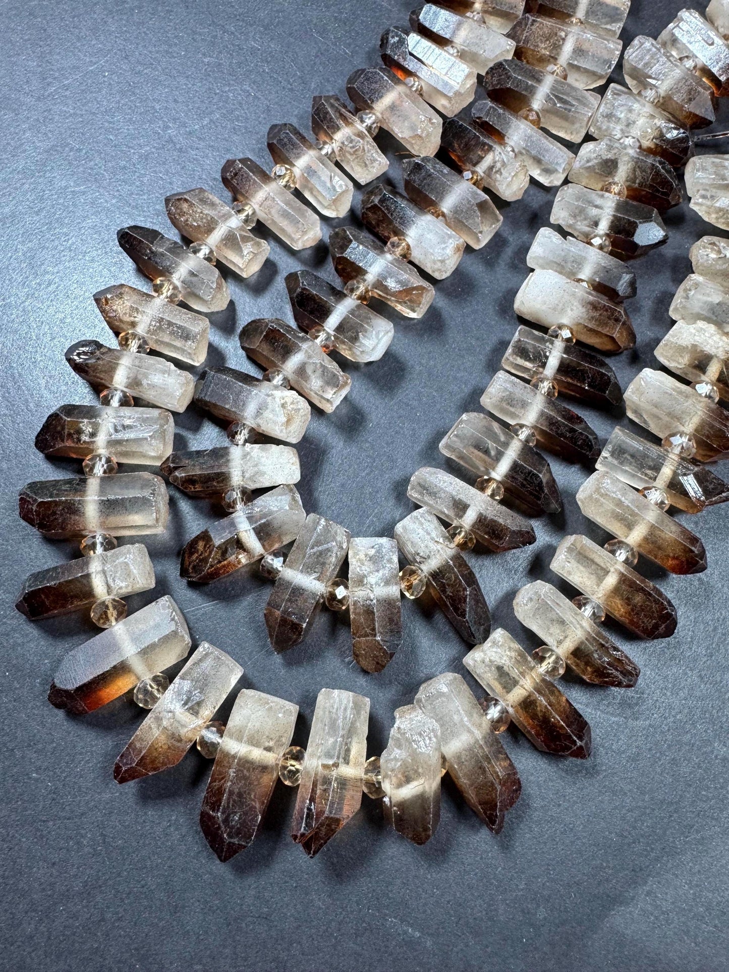 100% Natural Rock Crystal Quartz. Freedom Teeth Shape. Clear Brown Color. Full Strand 15.5"