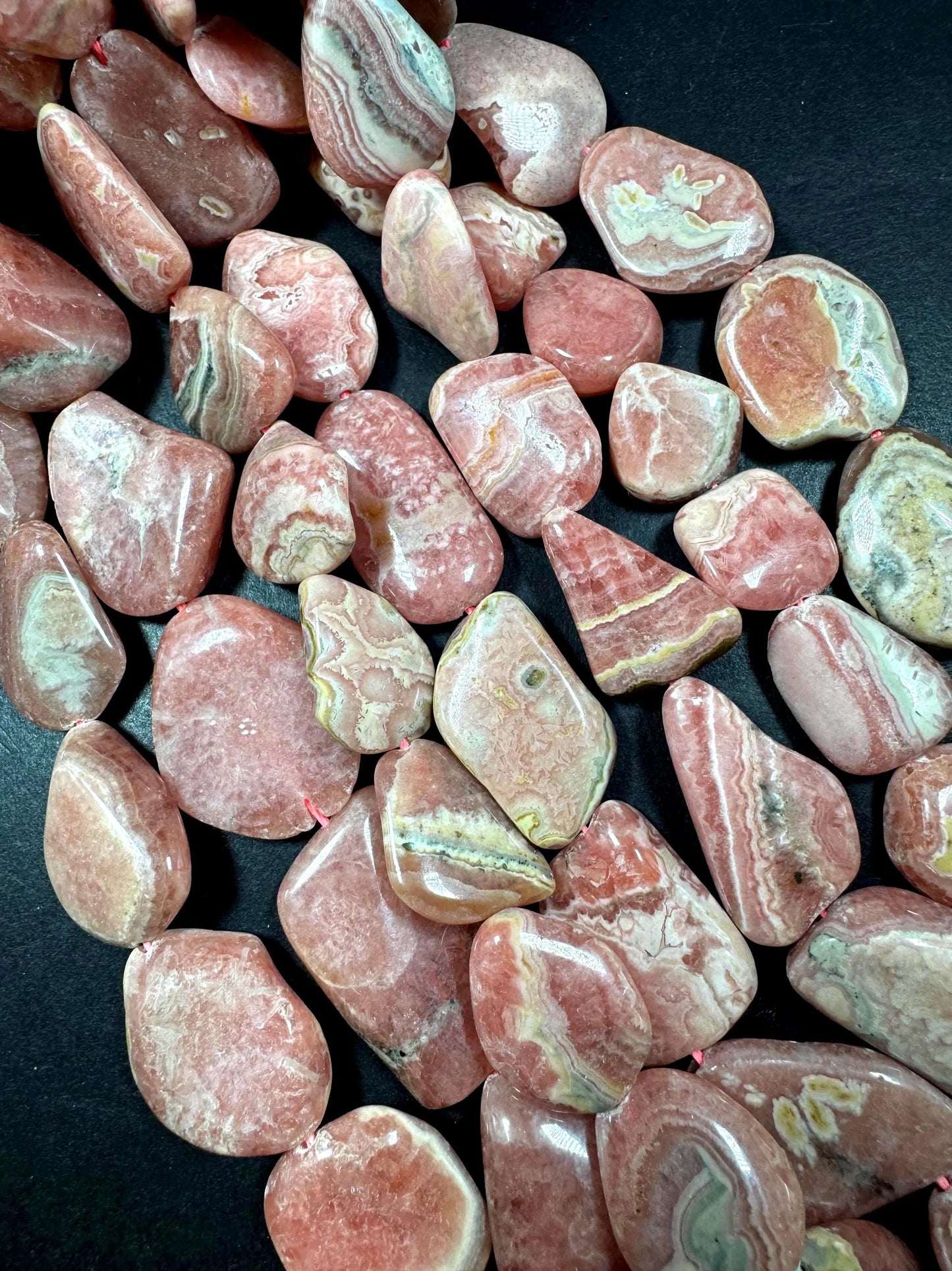 AAA Natural Rhodochrosite Gemstone Bead. Freedom nugget shape beautiful Natural rose pink color. Excellent quality. Full strand 15.5”